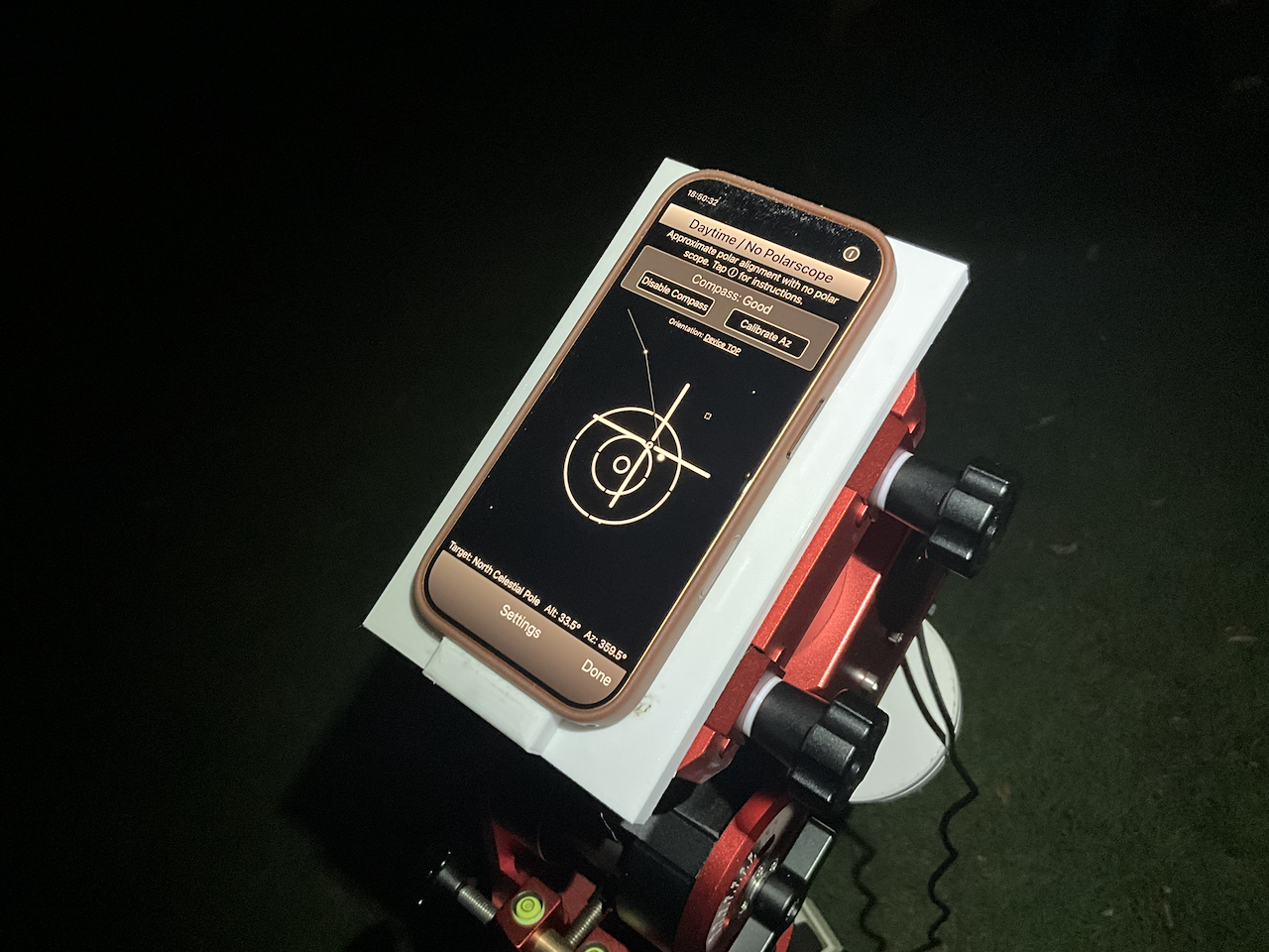 The phone on the mount with the polar alignment app showing a slight misalignment